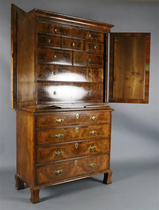 An early 18th century figured and burr walnut cabinet on chest, W.3ft 8in. D.1ft 8in. H.6ft 6.5in.